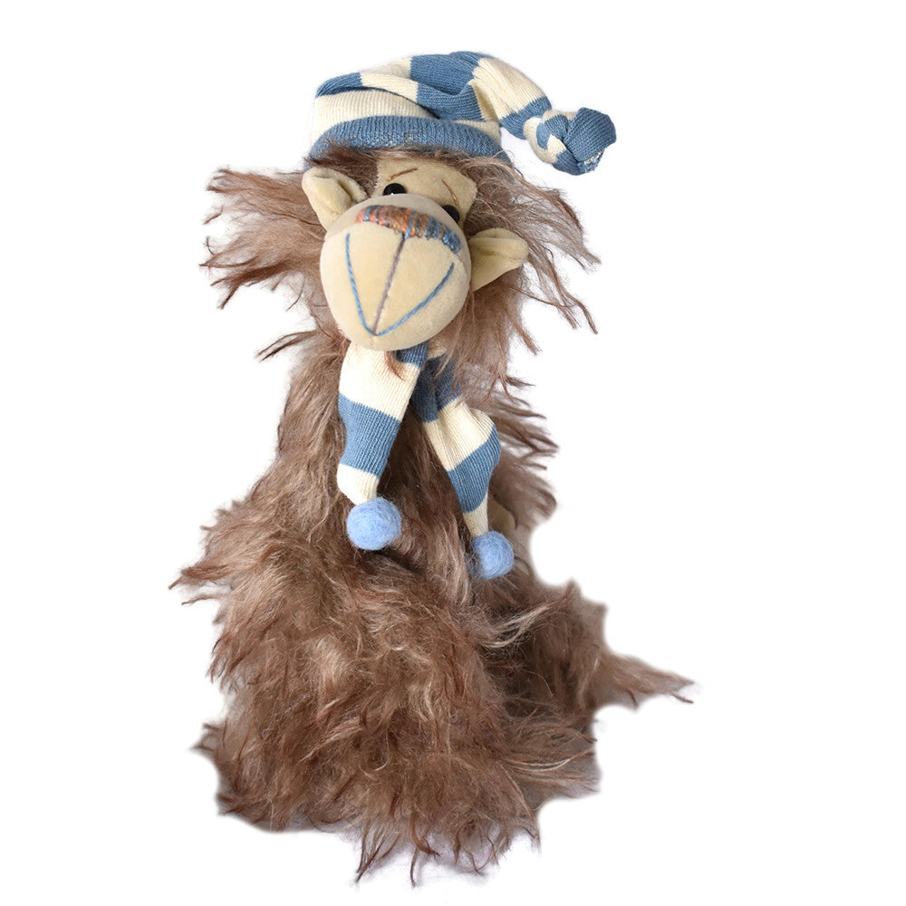 Handmade quirky teddy bear with a blue and white striped hat and scarf.