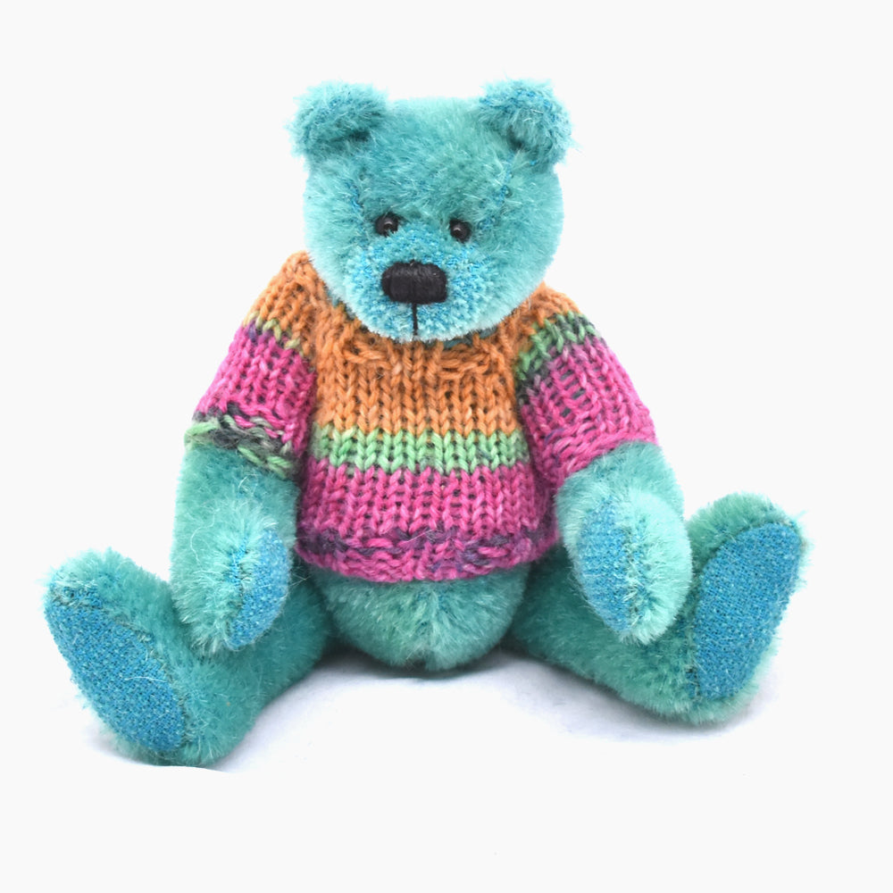 Bright green teddy bear sitting