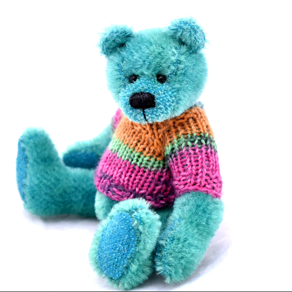 Bright green teddy bear sitting