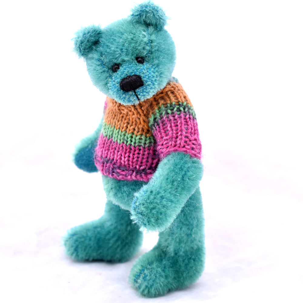 Bright green teddy bear standing