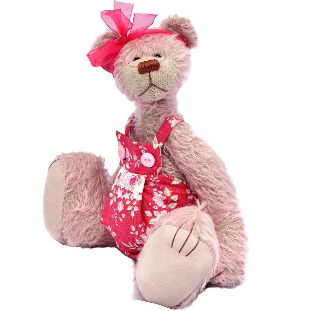 Pale pink mohair teddy bear sitting